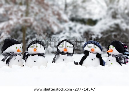 Winter snowman scene with snow and trees