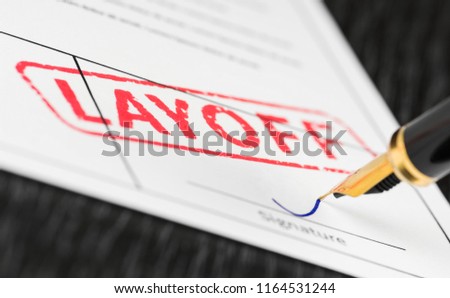 Seal layoff stamped on a document and fountain pen. Macro shot. Soft focus. Stockfoto © 
