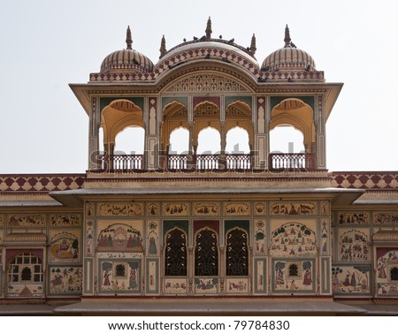 Domed upper structure with wall paintings on mansion outside India's Jaipur.
