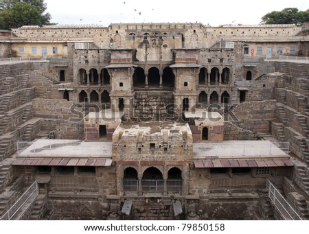 Palace section of the Abaneri stepwell in India's Rajasthan. Medieval construction is a turned up pyramid in the middle of nowhere.