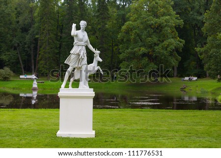 Beautiful antique marble sculpture of the goddess Artemis (a copy of XVIII century) adorns the parterre in the front lawn of the Chinese Palace. Oranienbaum. Russia
