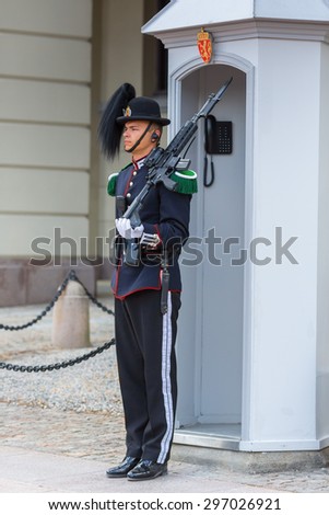 OSLO,NORWAY - JUNE 14: Royal Guard guarding Royal Palace on June 14, 2015 in Oslo, Norway.His Majesty the King\'s Guard keeps The Royal Palace and the Royal Family guarded for 24 hours a day