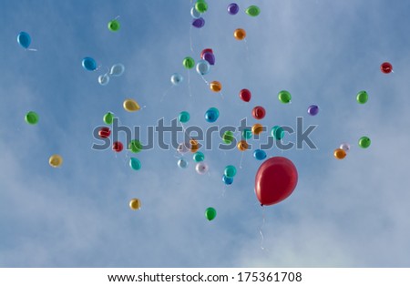 Balloons fly away into sky