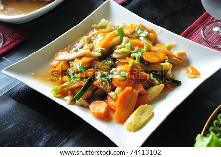 Mixed vegetables fried on a square white dish at Bali island, Indonesia