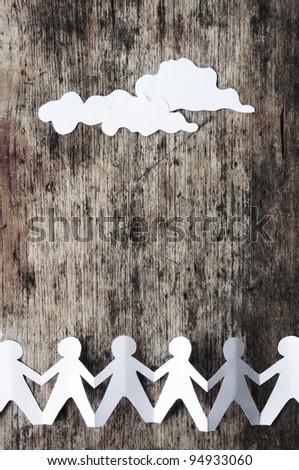 Group of human chain with cloud paper on the wood