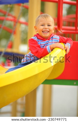 child playing on the slide