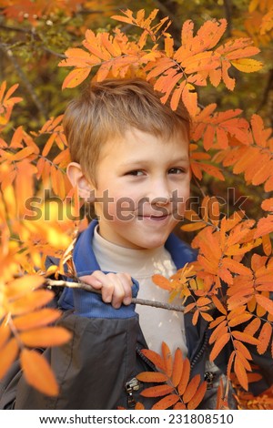 funny baby in autumn forest