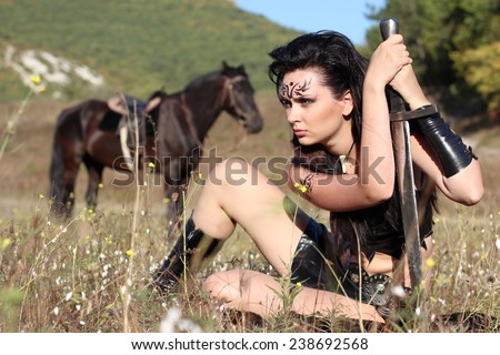 girl amazon warrior armed with a sword