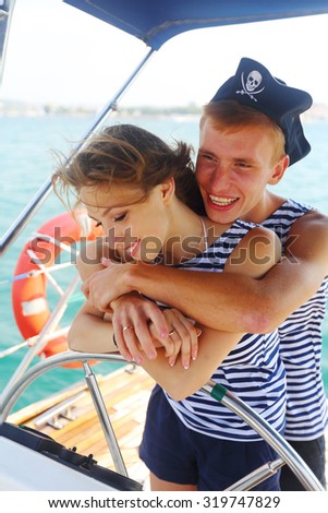 couple in love pirates at the helm