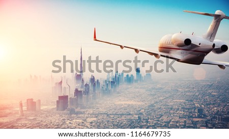 Private jet plane flying above Dubai city in beautiful sunset light. Modern and fastest mode of transportation, business life. Stock foto © 