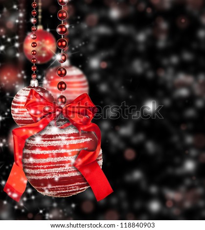 Christmas theme with red glass balls on black background