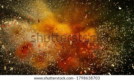 Freeze motion of various spice explosion, abstract culinary background