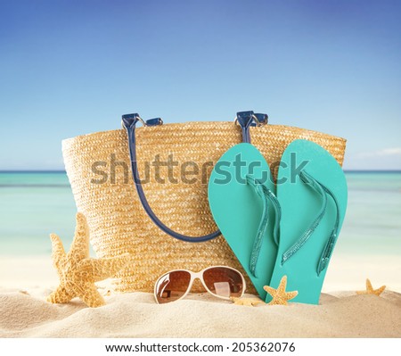 Summer concept with swimming accessories and blur sea on background