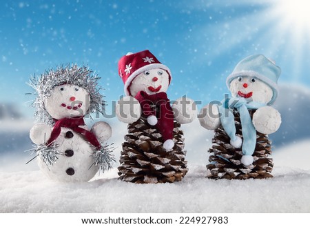 Winter holiday happy snow man with blur landscape on background