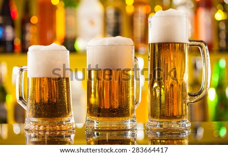 Jugs of beer placed on bar counter