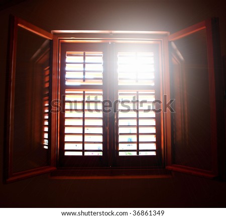 Wooden window with sunshine