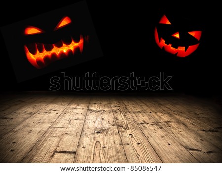 Halloween evil pumpkin faces in darkness