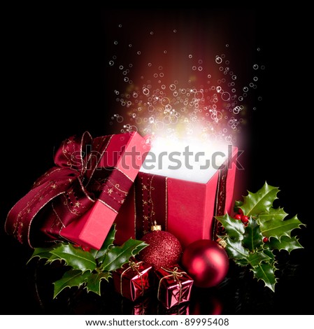 Christmas still life with opened gift and bubbles inside