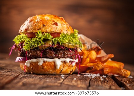 Similar – Image, Stock Photo Tasty hamburger served in restaurant