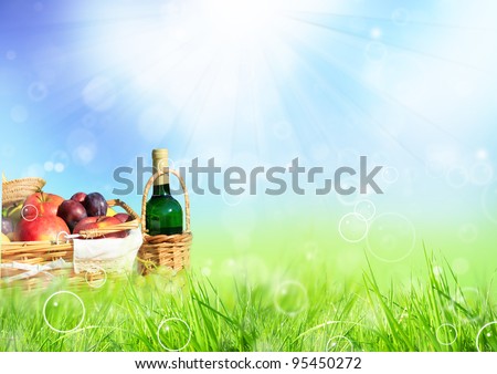 Beautiful spring scenery with picnic in meadow