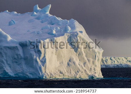Late day light covers beautiful iceberg in Antarctica