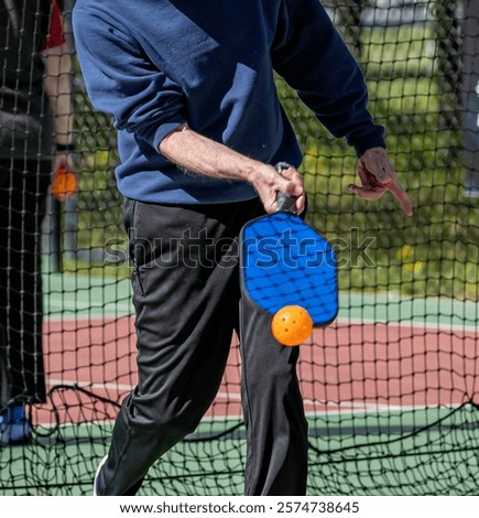 Similar – Image, Stock Photo senior man playing paddle tennis at indoors pitch, he is tired