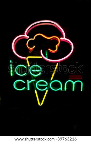 Neon ice cream cone sign at night