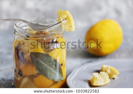 Similar – Image, Stock Photo Fermented lemons in jars of salt, chili pepper and rosemary. Probiotics Fermented food. Pickled lemons.