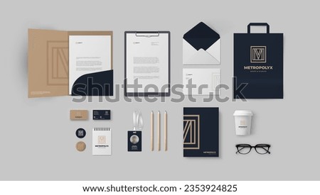 Premium corporate branding with square logo and M letter inside, brown and black backgrounds. Stationery template with folder, envelope, business cards and paper bag