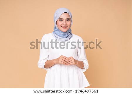 Similar – Image, Stock Photo Confident ethnic lady covering eye with hand in red studio