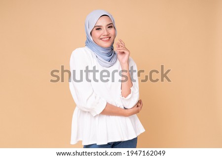 Image, Stock Photo Confident ethnic lady covering eye with hand in red studio