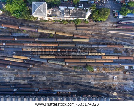 Freight and passenger train waiting at the train station parking lot.Cargo transit.import export and business logistic.Aerial view.industrial railway landscape. transportation.Thailand. Stock foto © 