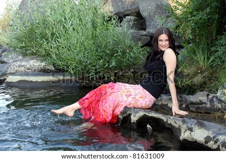 playful photo of pretty girl by the water; series of this model in portfolio