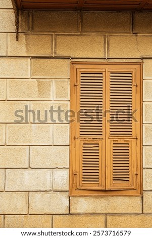 Weathered wooden shutter in a half-timbered house
