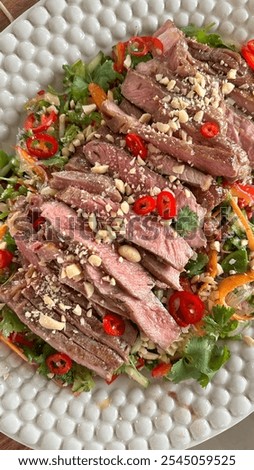 Similar – Image, Stock Photo Beef thai salad served on dish