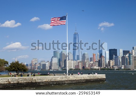 NEW YORK CITY, USA - OCTOBER 6, 2014: New York panorama, One World Trade Center (formerly known as the Freedom Tower) and Ellis Island. Freedom Tower is shown finished with antenna.