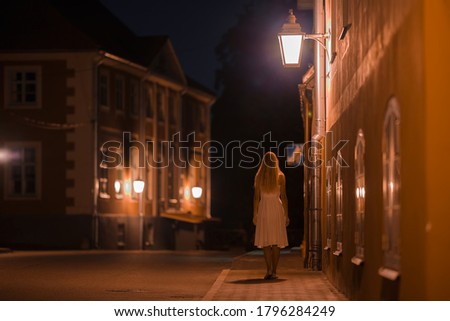 Similar – Image, Stock Photo Girl walking under a pine tree, looking at the sea