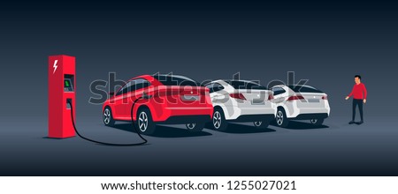 Vector illustration of a luxury red electric car suv charging at the charger station during night time low demand electricity. Other white cars parked behind along the road with a walking man. 