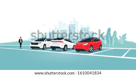 Modern car parking standing on empty or full parking lot area with man walking near vehicle. Travel park place on rest area near road highway to city. Person by car. Town skyline in the background.