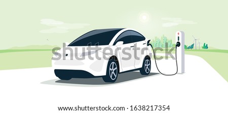 Electric car on charging station with green city street skyline. Battery EV vehicle plugged and getting electricity from renewable power generations solar panel, wind turbine. Vehicle being charged.