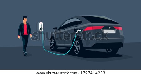 Electric car charging in underground garage home plugged to charger station. Battery EV vehicle standing parking lot connected to wall box. Close up vector being charged with power supply socket. 