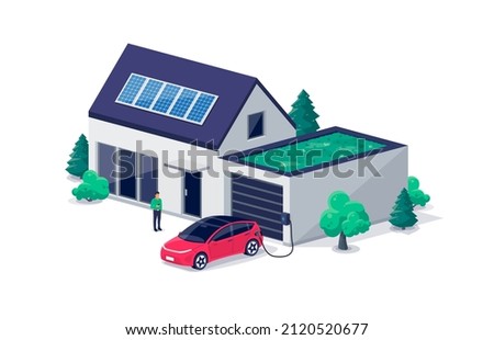 Electric car parking charging at home garage with green roof wall box charger station. Residence family house building with clean energy photovoltaic solar panels. Renewable smart power electricity.