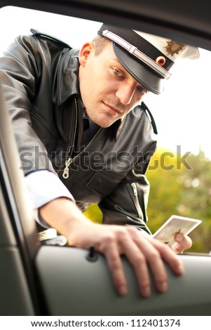 Police officer is doing a traffic check