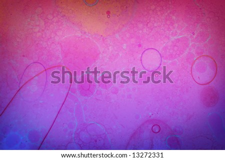 Grunge abstract background of cell like structures and bubbles on a purple pink background