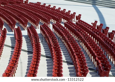 Red concert chairs in the Jay Pritzker Pavilion, designed by Frank Gehry. Millennium Park, Chicago.