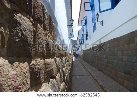 View of a street in cusco. The buildings are made of adobe with a stone foundation. Cusco, Peru, South America.