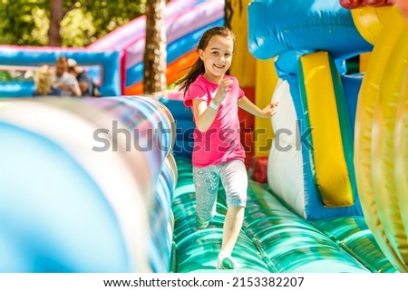 Similar – Image, Stock Photo Cute child with inflatable swimming ring and diving mask sitting on bed in hotel room. Playing, laughing, smiling. Happy family vacation.