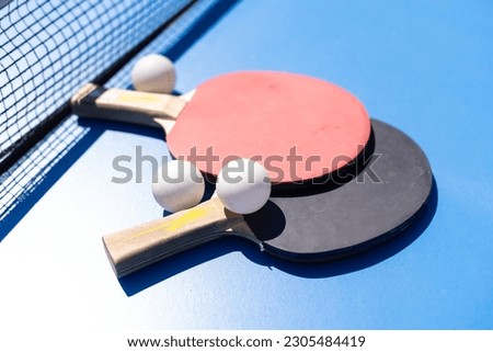 Similar – Foto Bild Roter Schläger für Tischtennis mit weißem Ball auf blauem Hintergrund. Tischtennis-Sportgerät in minimalem Stil. Flachlegung, Draufsicht, Kopierraum