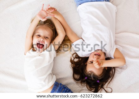 Similar – Image, Stock Photo Two little girls are fishing in ocean surf at sunset. Summer leisure, hobby and fun for kids.