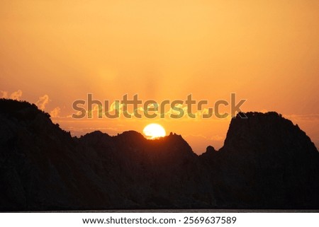 Similar – Foto Bild Die Sonne verschwindet hinter den Bäumen. Hinter dem Haus ist es schon dunkel. Eine starke Bewölkung gibt dem ganzen ein prächtiges Panorama.